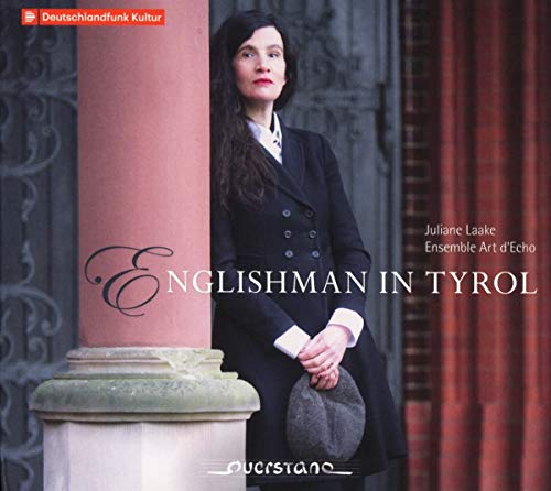 "CD cover featuring a woman in a black coat standing beside a pillar."