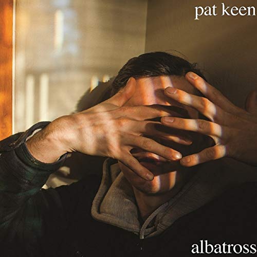 "Album cover: person covering face with hands, 'pat keen' and 'albatross' text."
