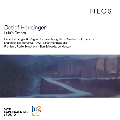 A CD cover featuring a misty, blue-toned image with text and logos.