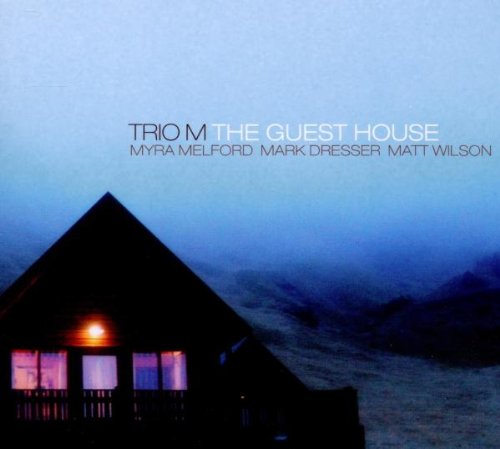 "CD cover featuring a lit cabin in a foggy landscape at dusk."