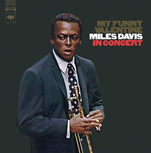 CD album cover featuring Miles Davis holding a trumpet, against a dark background.