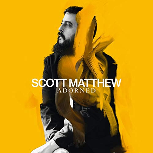 "Album cover featuring a man with a beard against a yellow background."