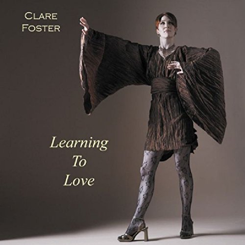 "Album cover featuring a woman in a flowing brown dress and high heels."