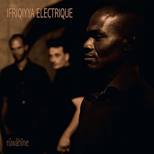 "Album cover featuring three men in dark attire, with text 'Ifriqiyya Electrique' and 'ruwahine'."