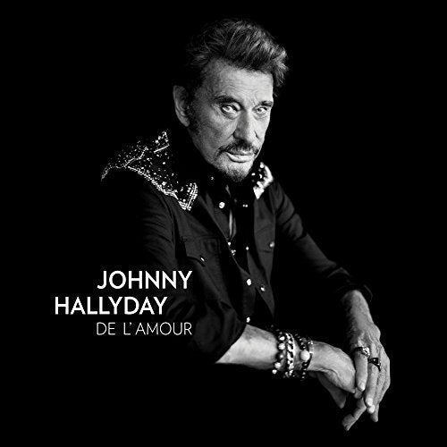 Johnny Hallyday CD cover with black and white photo of man in dark clothing.
