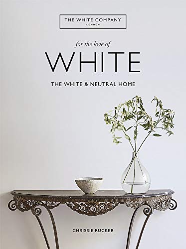 "Book cover with a vase, bowl, and ornate table against a white background."