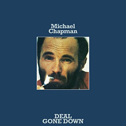 "Album cover with a man's portrait, smoking, on a dark blue background."
