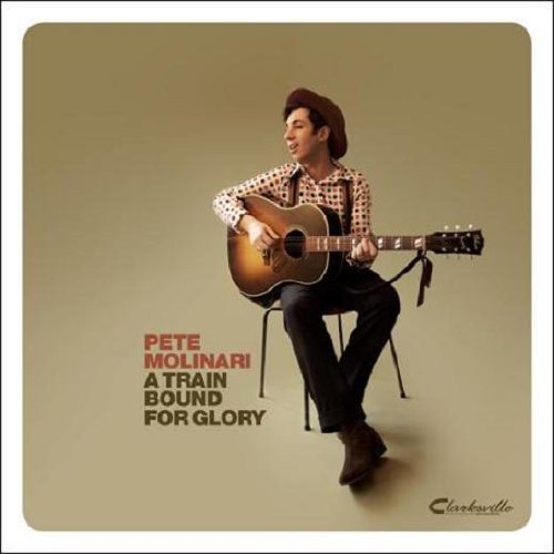 "Album cover featuring Pete Molinari sitting with an acoustic guitar, beige background."