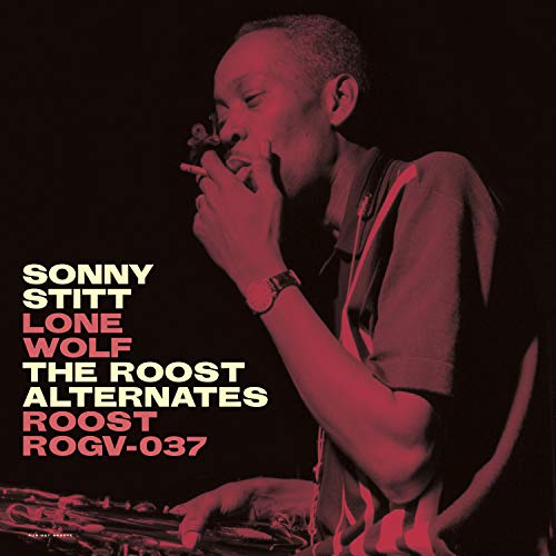Vinyl album cover featuring a man playing saxophone, lit in red, against a black background.
