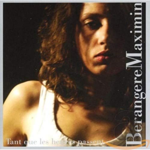 CD cover featuring a woman with curly hair and white tank top, text on edges.