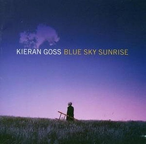 "Album cover featuring a person in a field at dusk with a chair."