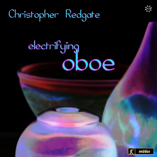The image is a CD cover featuring iridescent glass objects and text on a black background.
