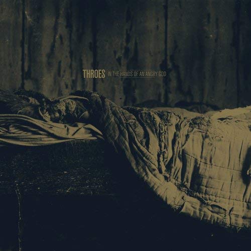 A sepia-toned album cover with a person lying on a bed, partially covered by a blanket.