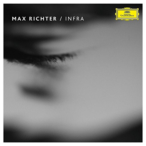 Vinyl album cover with a blurred black and white close-up of a face.