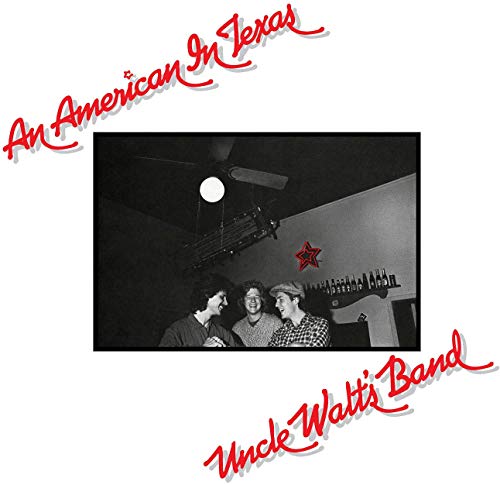 "Vinyl album cover with black and white photo of three men and red text."