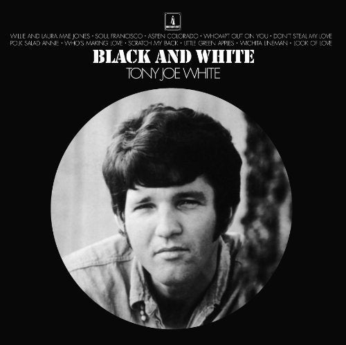 Black and white vinyl album cover with a man's portrait.
