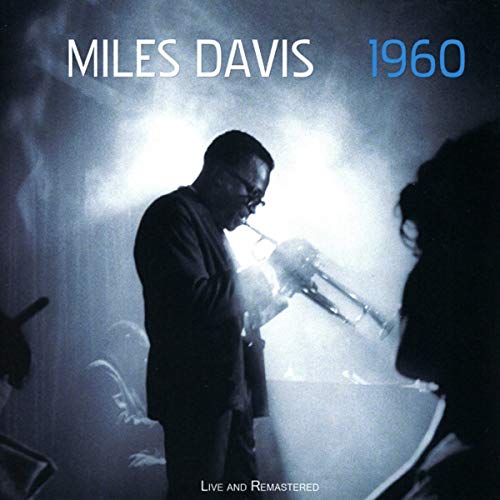 Album cover featuring Miles Davis playing trumpet on stage with foggy background.