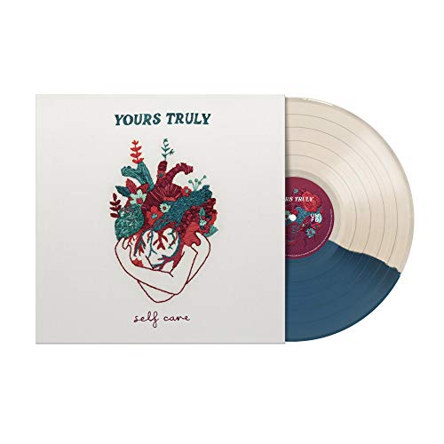 A vinyl record sleeve with a blue and white vinyl record partially visible.