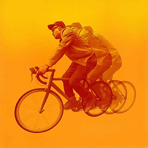 The alt text for the image is: "Vinyl record cover with man riding a bicycle on orange background."