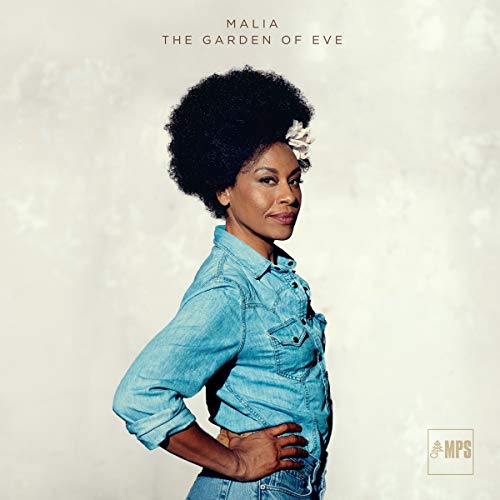 Album cover featuring a woman with an afro and denim shirt against a beige background.