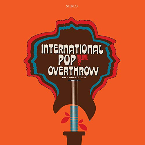 An orange album cover featuring a brown guitar with blue and red outlines.