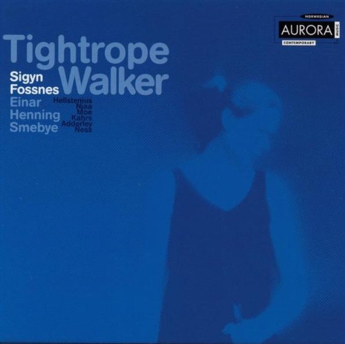 "Album cover with blue background, faded image of a woman, and artist names."