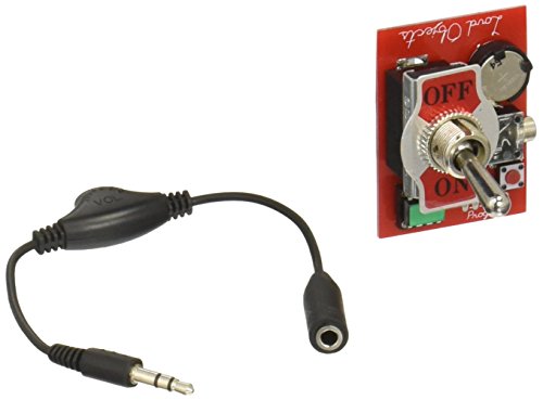 Red circuit board with toggle switch next to black audio cable with connectors.