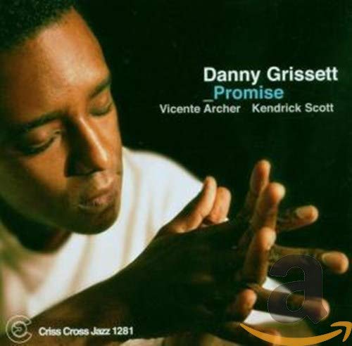 "Danny Grissett's album cover: a man with closed eyes, hands clasped together."