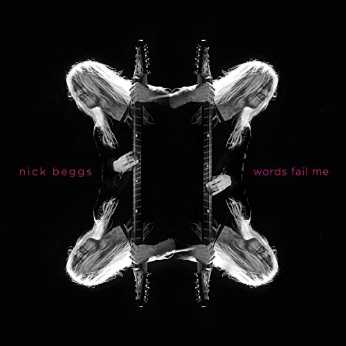 "Album cover with mirrored image of a man holding two guitars against a black background."