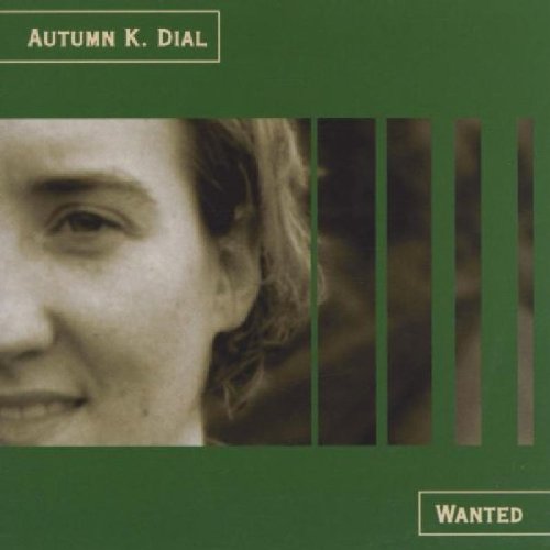 "CD cover with sepia-toned woman's face and green bars, artist's name at top."