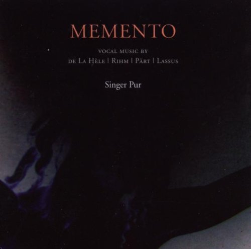 A CD cover with "MEMENTO" in orange text on a dark background.