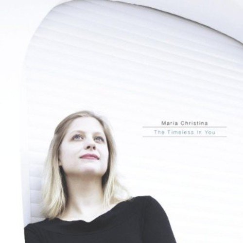 Album cover featuring a blonde woman in a black top against a white background.