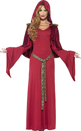 Woman in red hooded robe and dress with green sash, standing with arms outstretched.