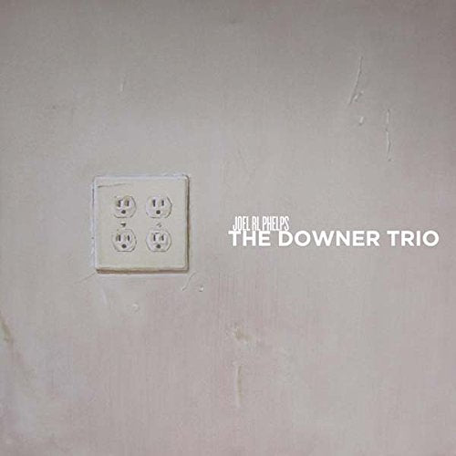 A music CD cover featuring a white wall with an electrical outlet.