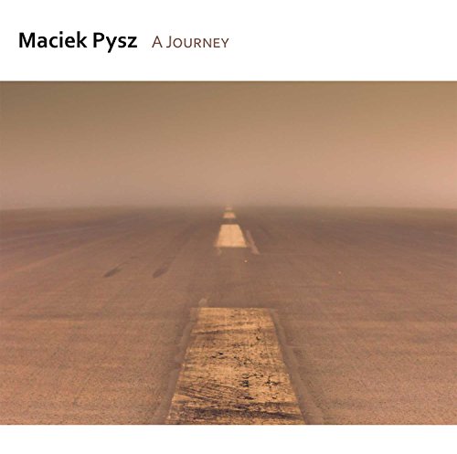 "Album cover featuring a foggy road with a central white line."