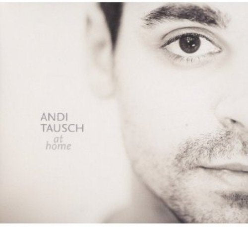 "CD cover with a close-up of a man's face and text 'Andi Tausch at home'."