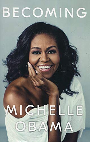The image is a book cover featuring a smiling woman. The alt text for this image could be: "Book cover with Michelle Obama smiling, wearing a white top."