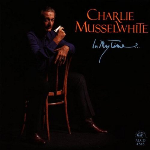 Charlie Musselwhite's album cover featuring a man sitting on a wooden chair.