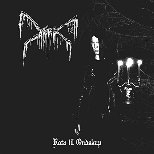 Black and white album cover with a man and candelabra, surrounded by dark atmosphere.