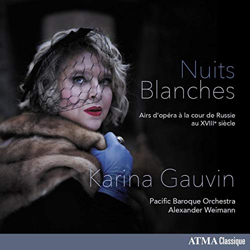 Woman in fur coat and black veil on opera CD cover with title and artist name.
