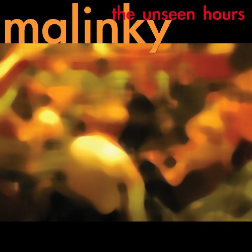 "Album cover with orange and red text on black background, blurry abstract image."