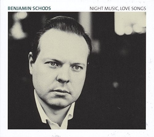 "Album cover with black and white portrait of man against dark background."