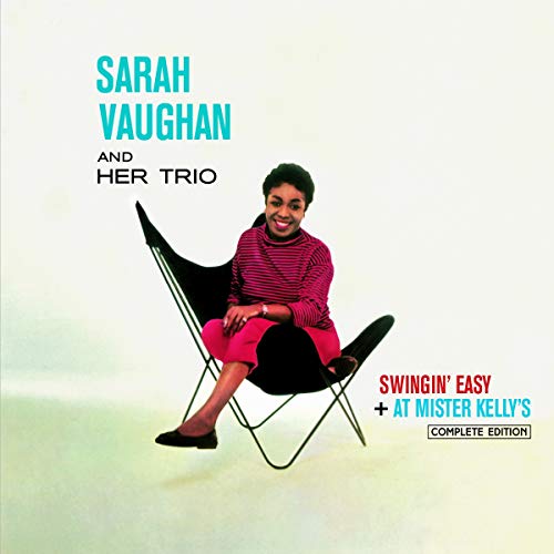 Sarah Vaughan sits in a black chair on a music album cover.