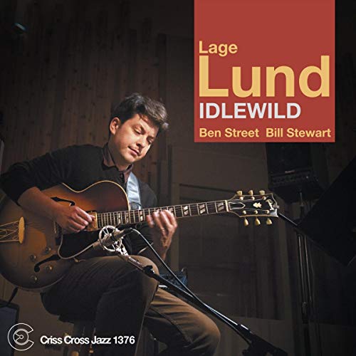The alt text for the image is: "Man playing guitar on album cover with red title banner."