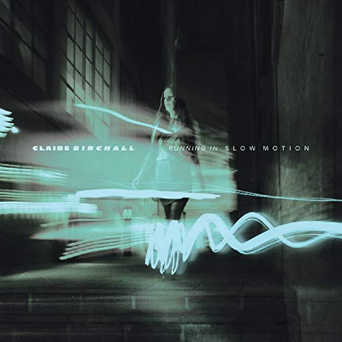 Blurry image of a woman running, with motion lines, on a dark background.