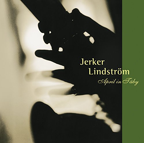 Album cover featuring a close-up of a hand holding a guitar, with green accent.