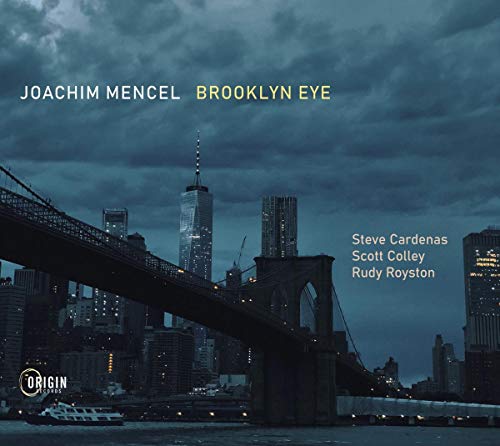 The image depicts a CD cover for "Joachim Mencel - Brooklyn Eye". Alt text: "CD cover with Brooklyn Bridge and city skyline at dusk."