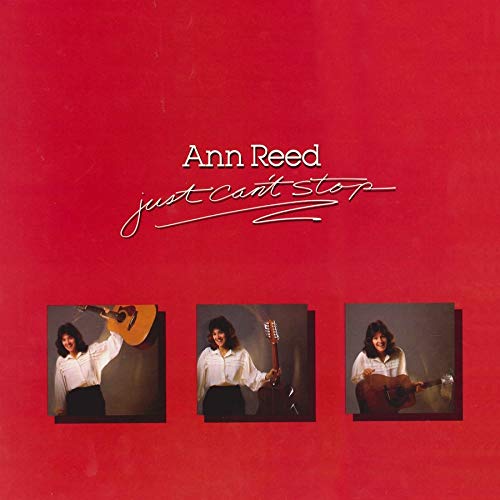 Red album cover with Ann Reed's name and three images of her playing guitar.