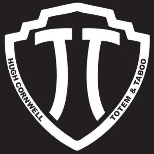 "Album cover for 'Totem & Taboo' by Hugh Cornwell, featuring a white shield logo on black."
