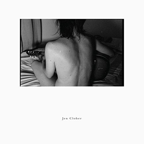 Black and white album cover featuring a shirtless person sitting on a bed with a guitar.